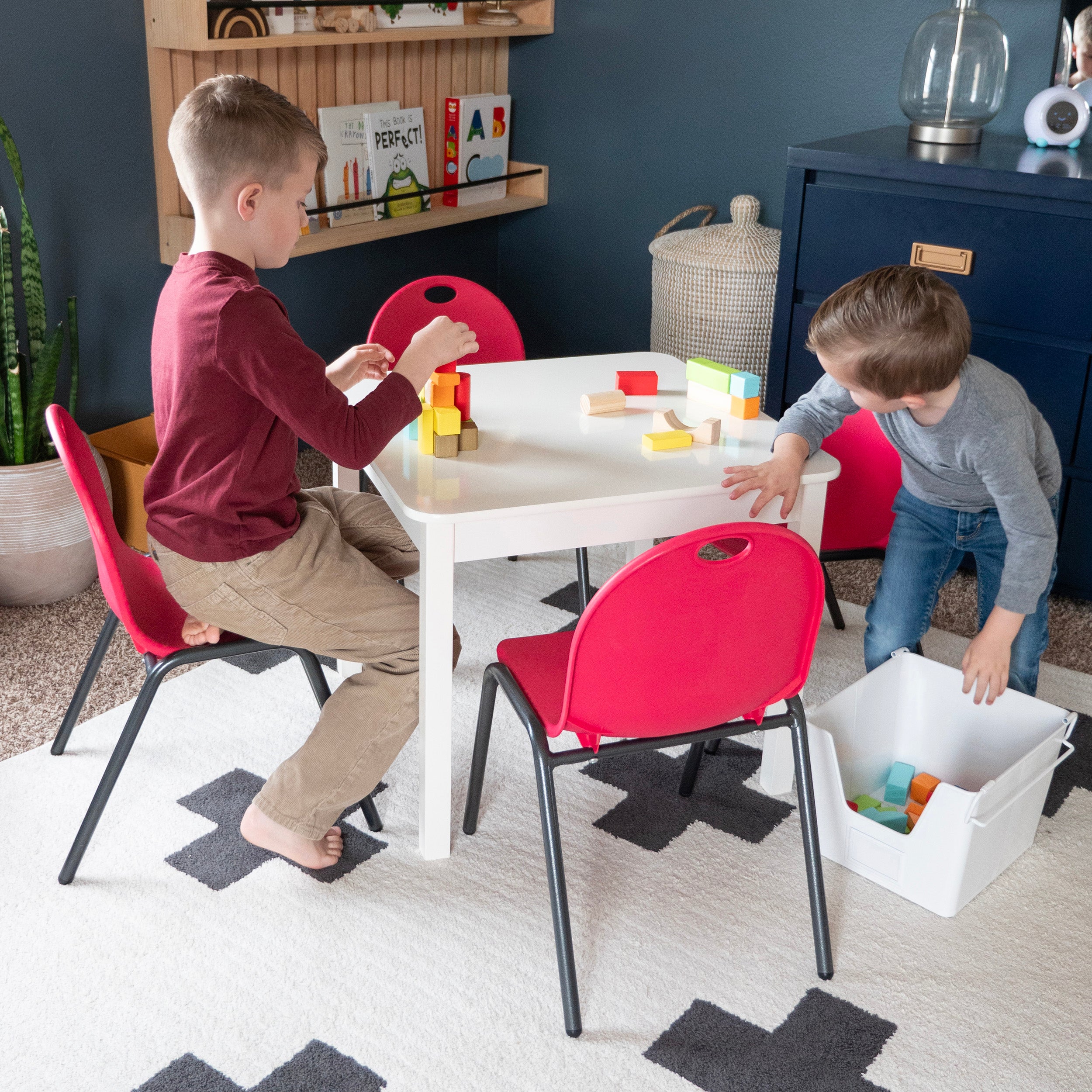 Kid playing on Stacking Chairs 