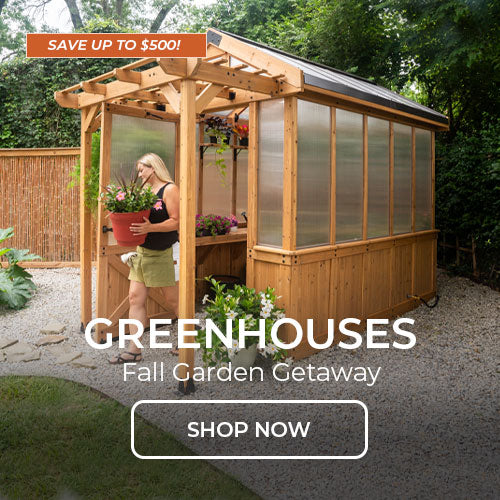 Wooden greenhouse with person gardening. Shop greenhouses.