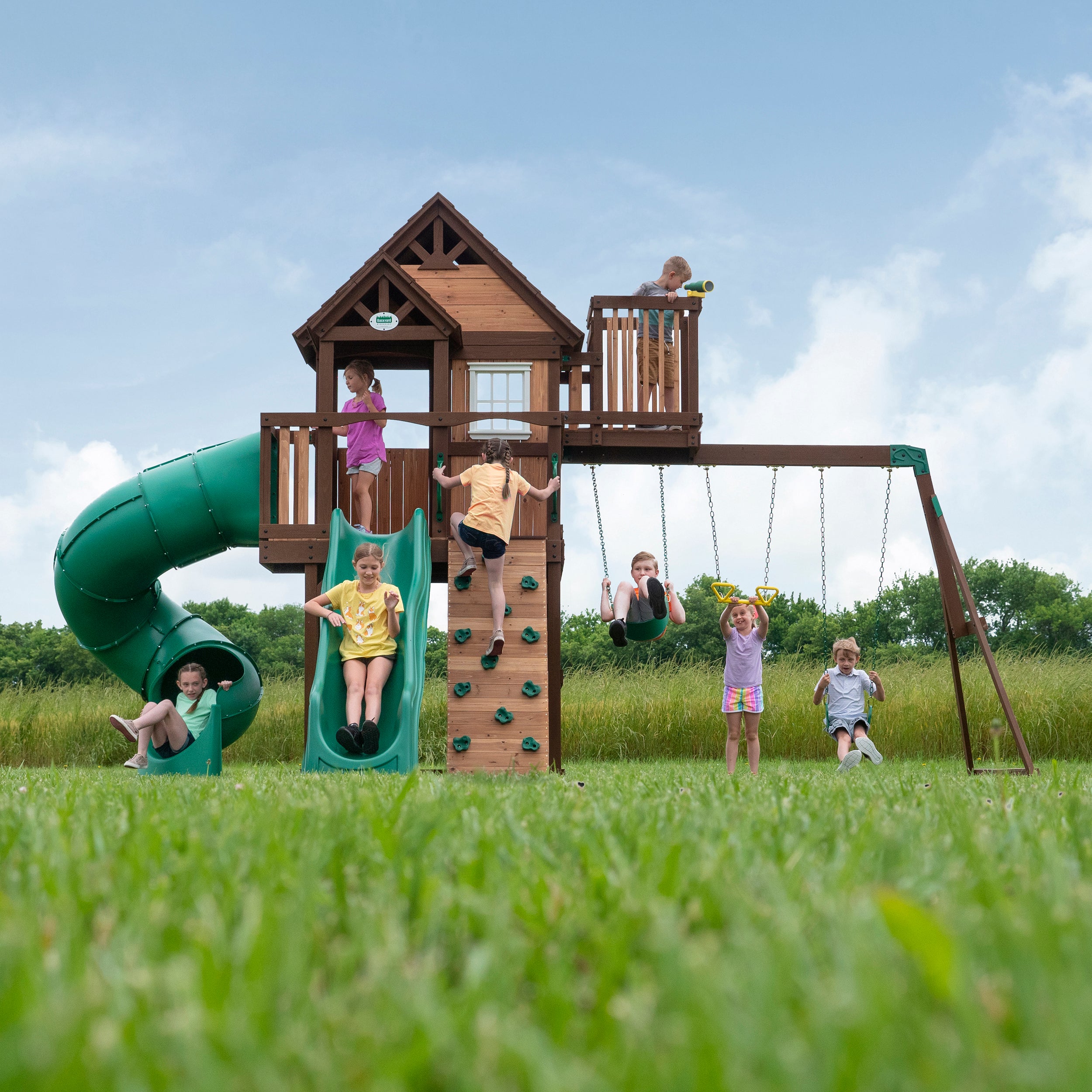 Skyfort III Wooden Swing Set with happy kids