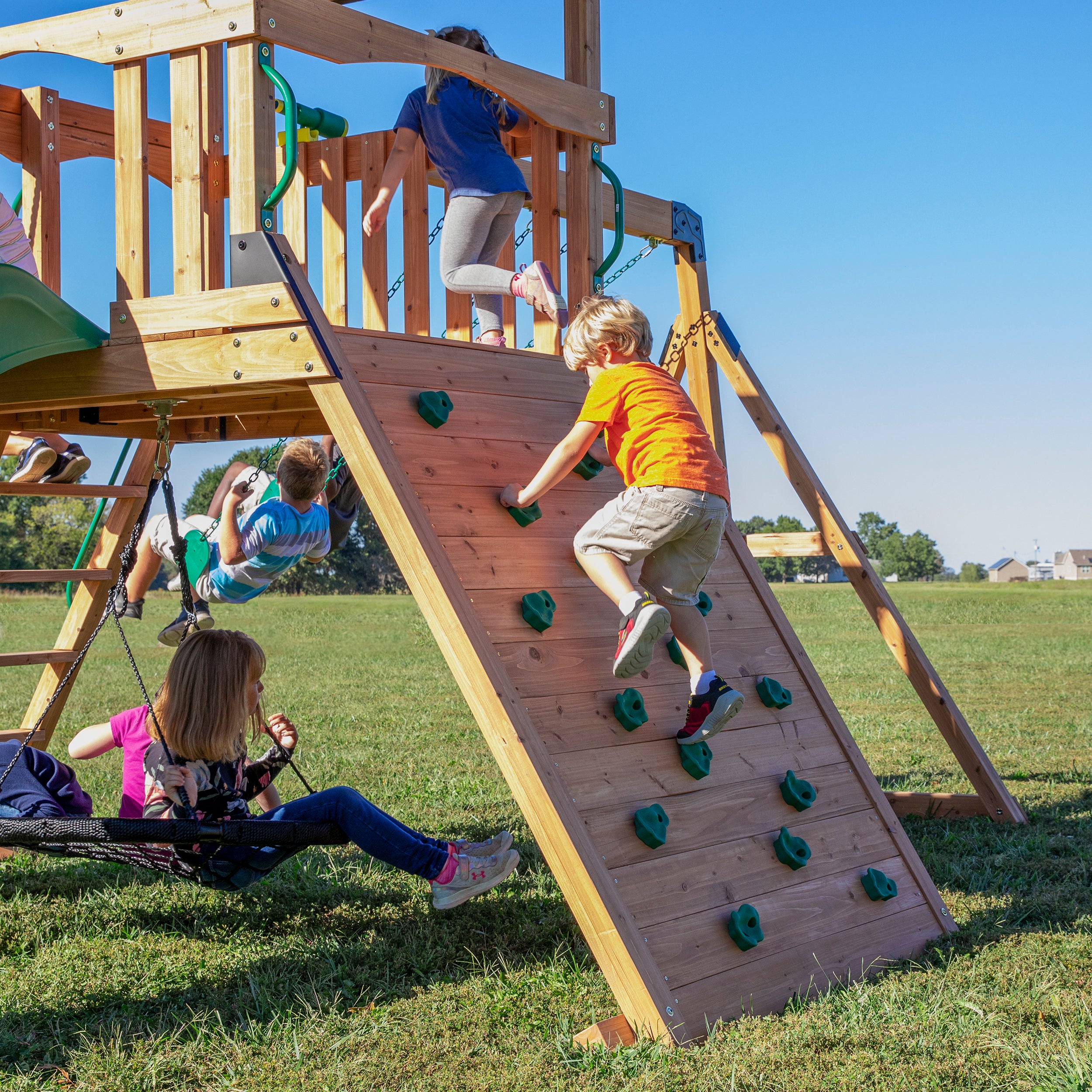 Child playing on rock climbing wall